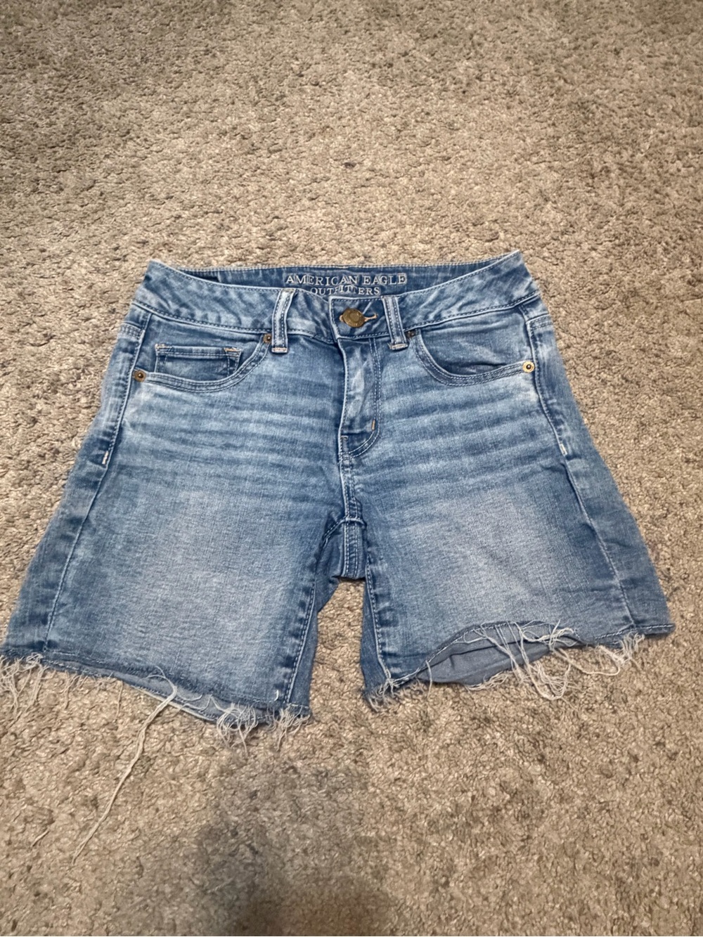 American Eagle Outfitters faded blue denim cutoff shorts